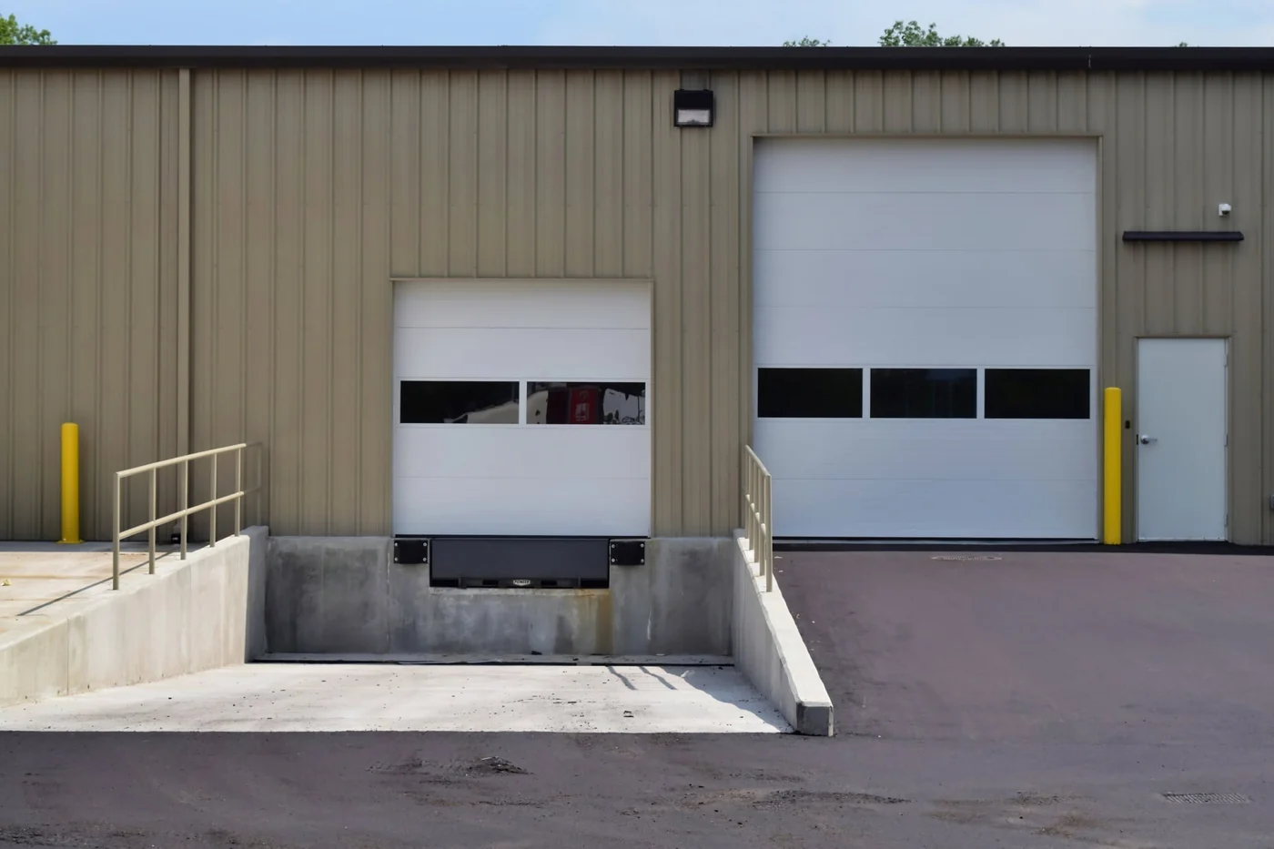 Buck Steel commercial steel warehouse with recessed loading dock and sectional doors in Nolensville, Tennessee